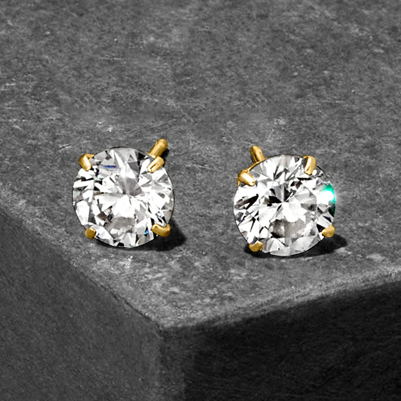 Round CZ stud earrings in 14kt yellow gold, angled view of bezel-set stones