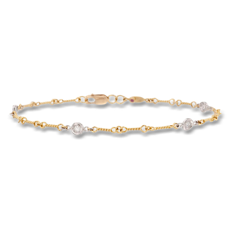 Two-tone gold diamond bezel link bracelet with round stones and lobster clasp