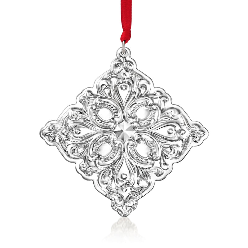 Sterling silver baroque snowflake ornament with hanging red ribbon