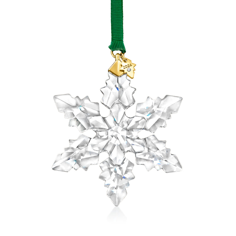 Crystal snowflake ornament with faceted white design and green ribbon, gold year tag.