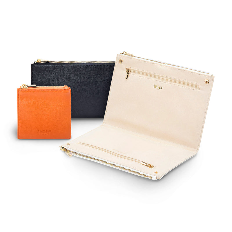 Three-pouch jewelry storage set in black, cream and orange vegan leather with zip closures