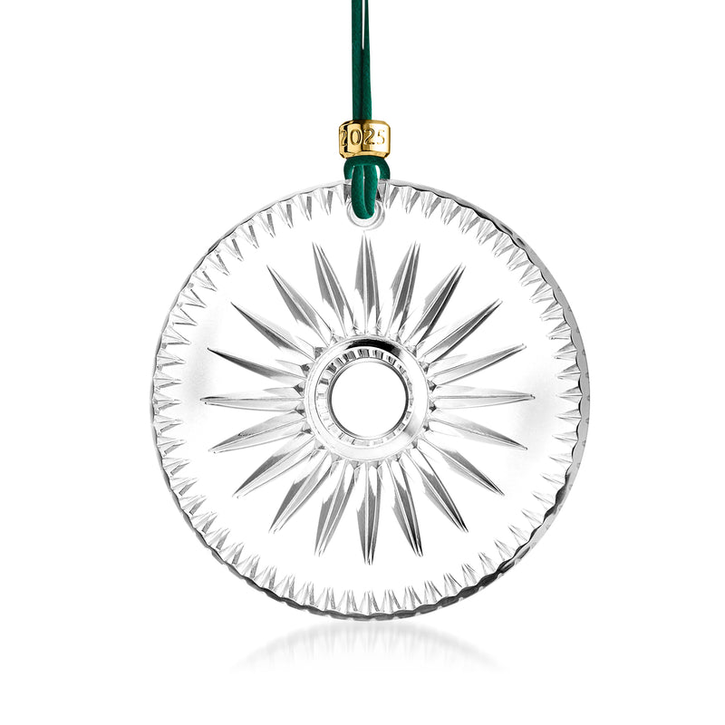 Clear crystal disc ornament with starburst engraving and green hanging loop