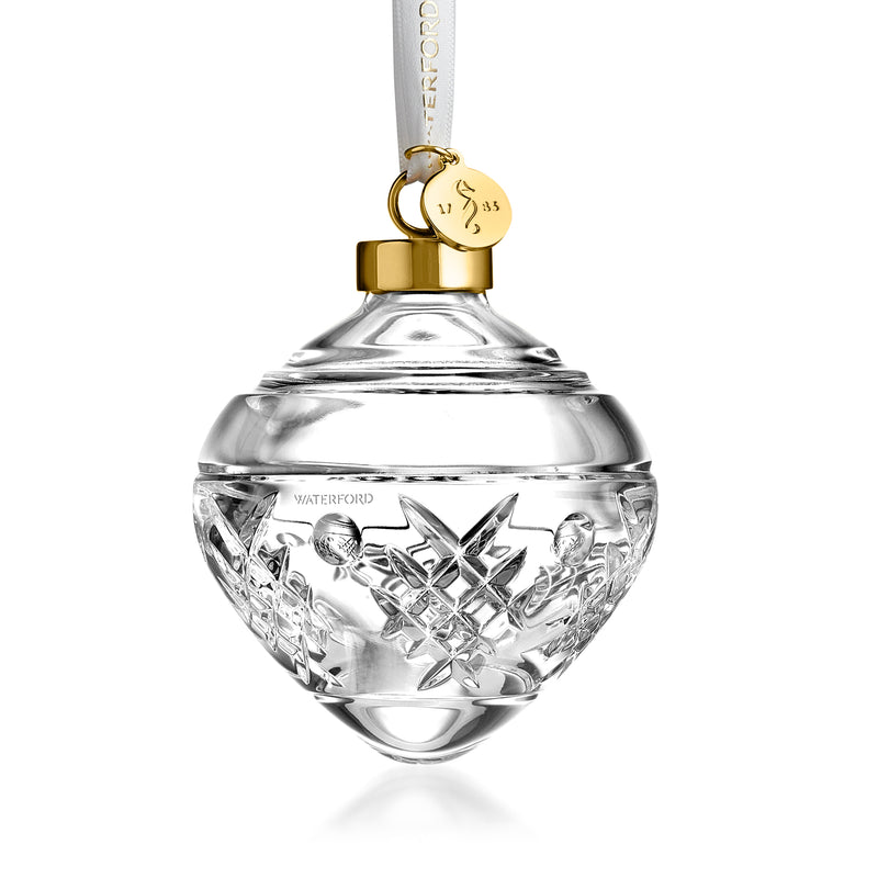Clear crystal bauble ornament with gold cap, hanging loop, and engraved winter pattern