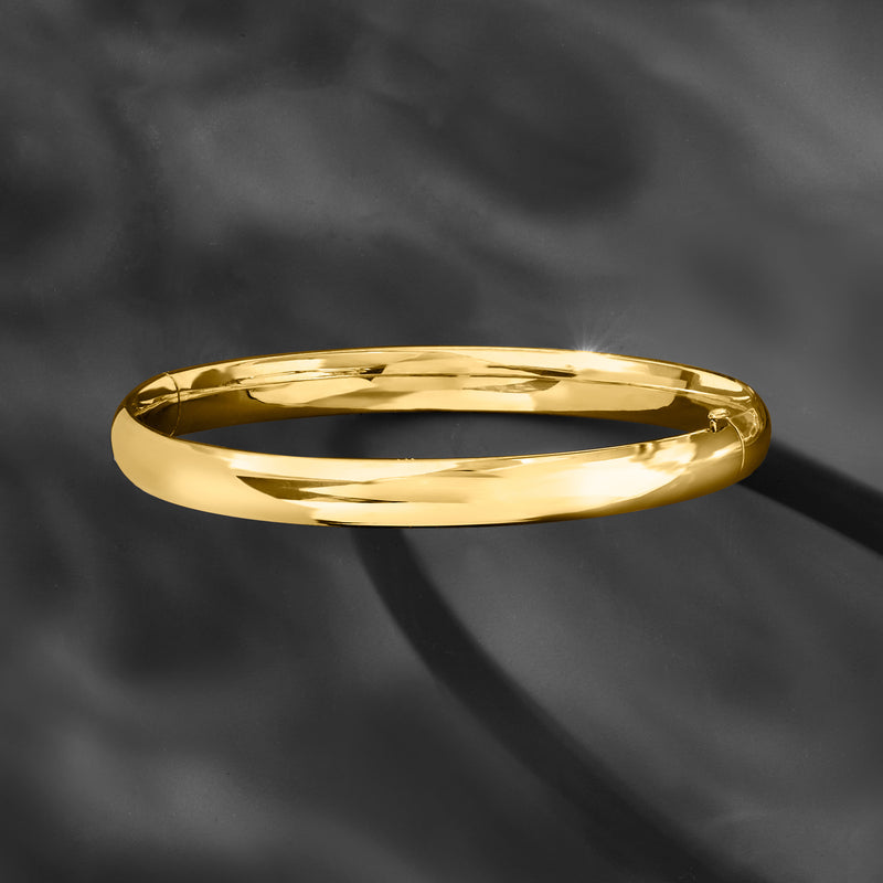 Polished yellow gold bangle bracelet, smooth high-shine round design with clasp