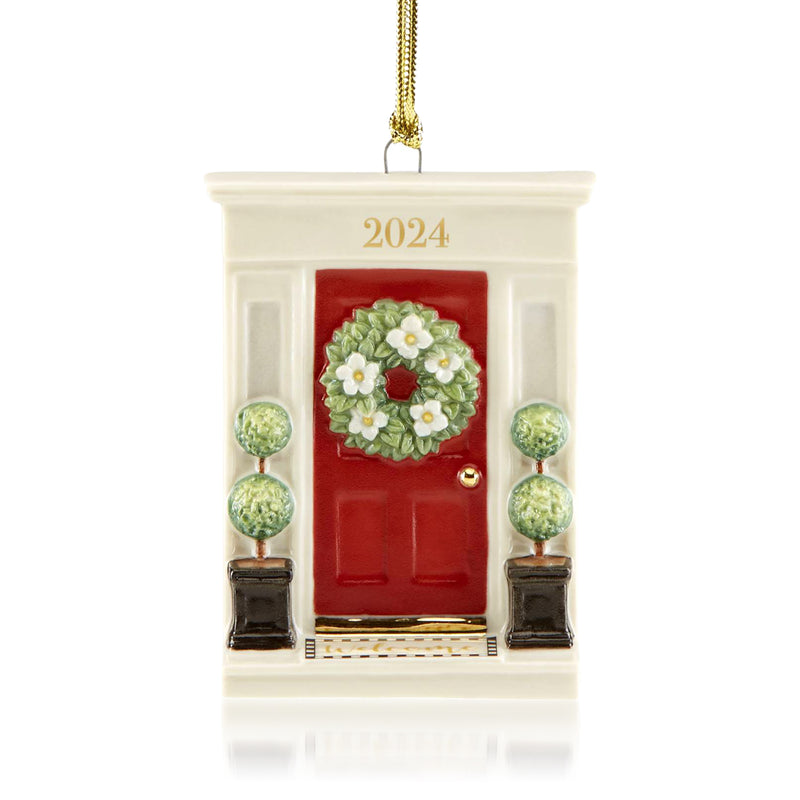 Porcelain front door ornament with red door, green wreath, and 2024 date