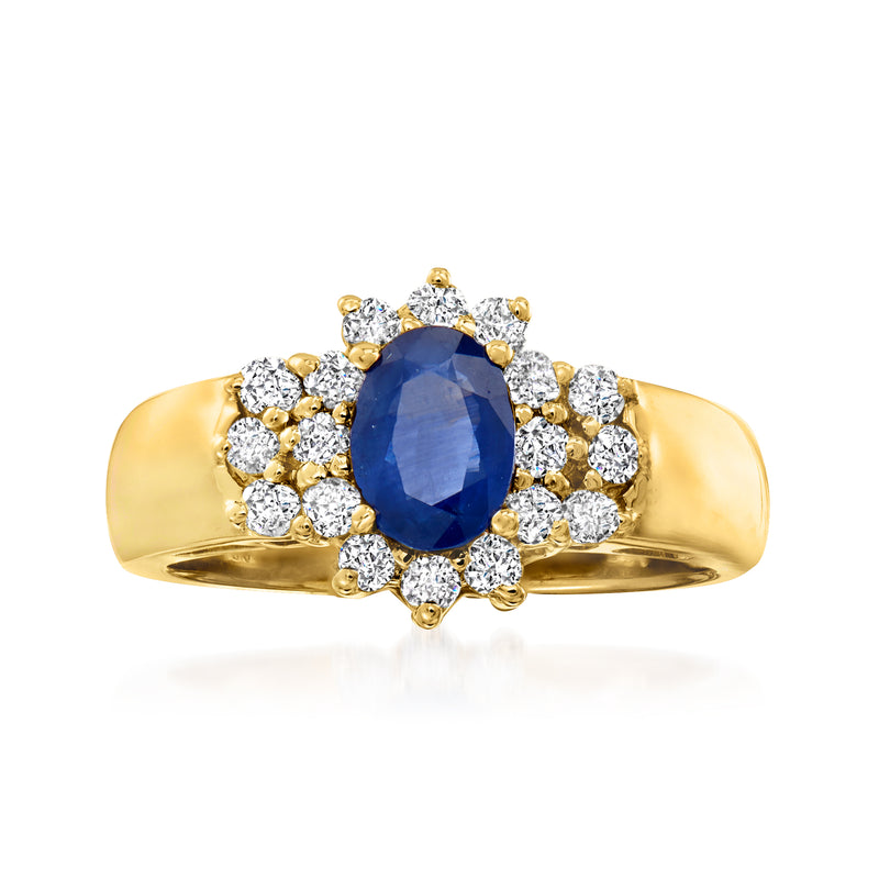 14kt yellow gold ring with oval sapphire center and diamond halo