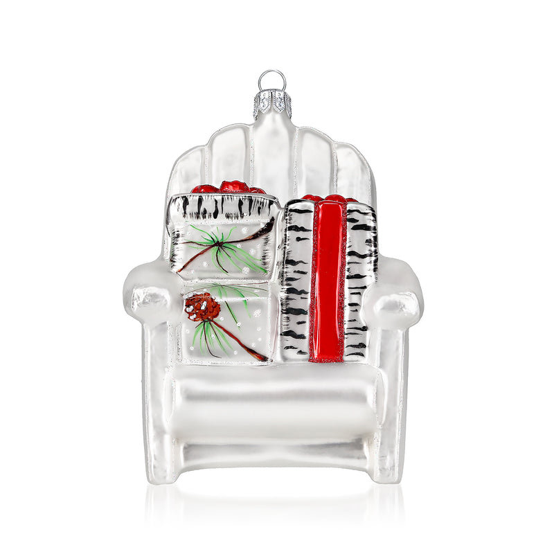 Clear glass holiday chair ornament with red-and-black striped cushion and small wreath