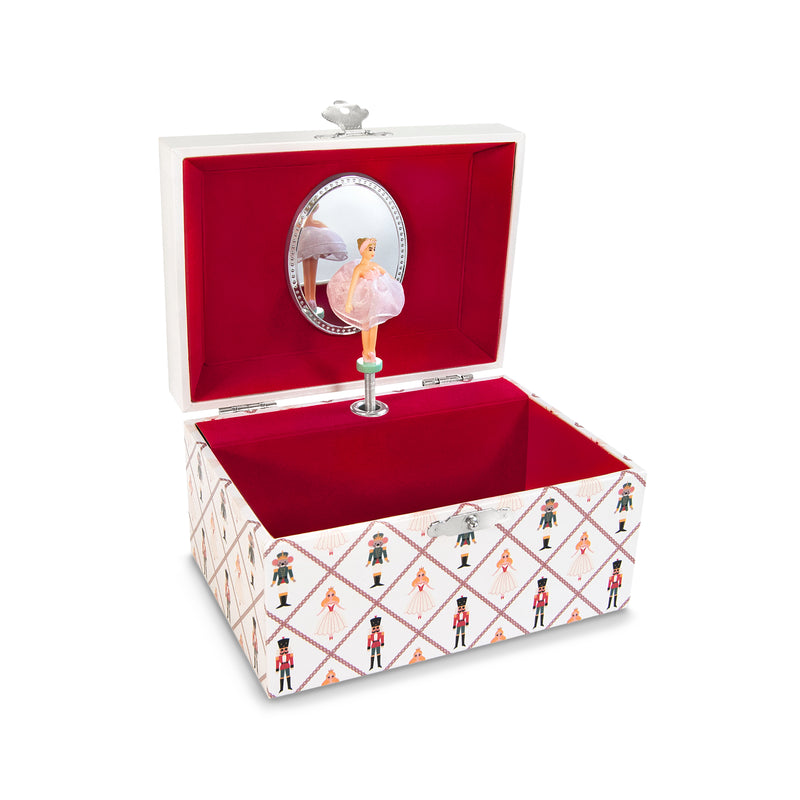 Child's musical nutcracker jewelry box, open red interior, white patterned sides