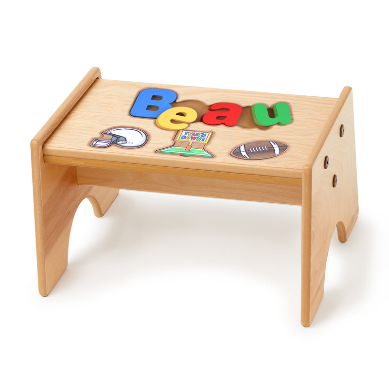 Maple-finished wooden puzzle stool with colorful name letters and football graphics on top