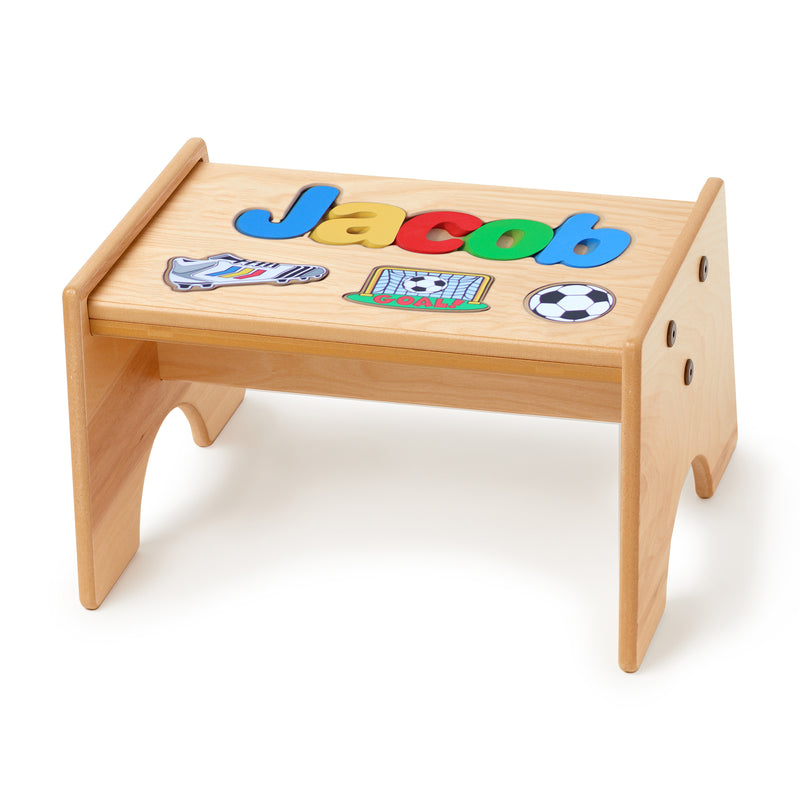 Personalized soccer-themed wooden puzzle stool with primary-color top and cutout letters