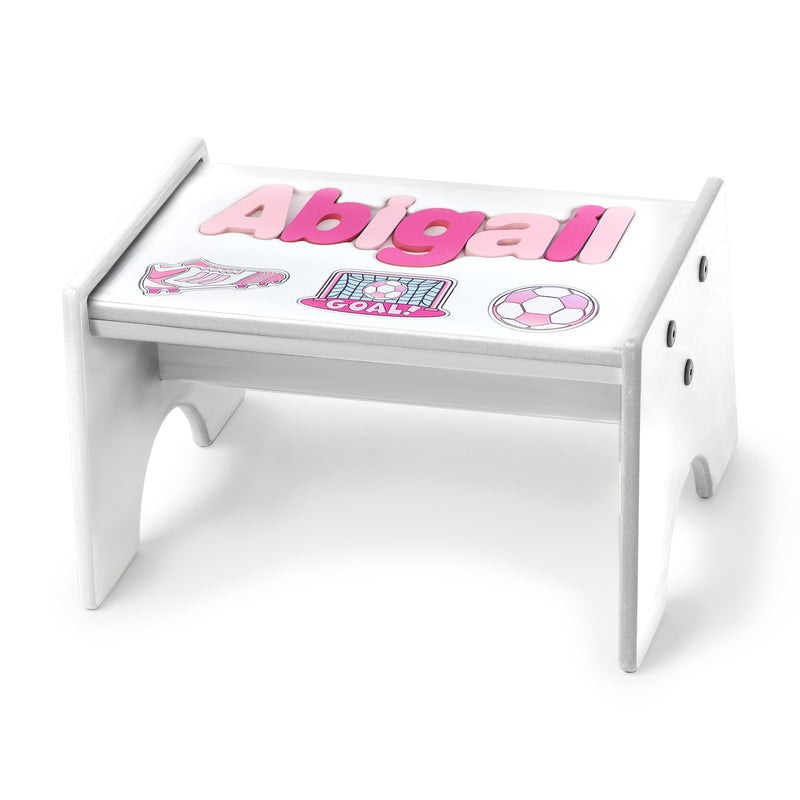Child's personalized soccer-themed puzzle stool, white with pink name and ball graphic