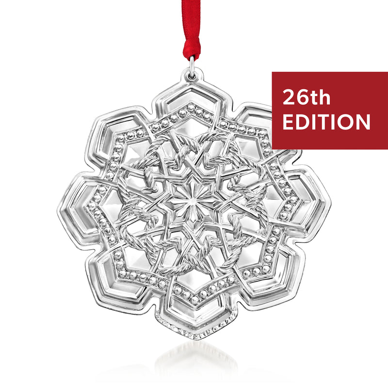 Sterling silver Celtic ornament with knotwork center, hanging on red ribbon, 26th edition