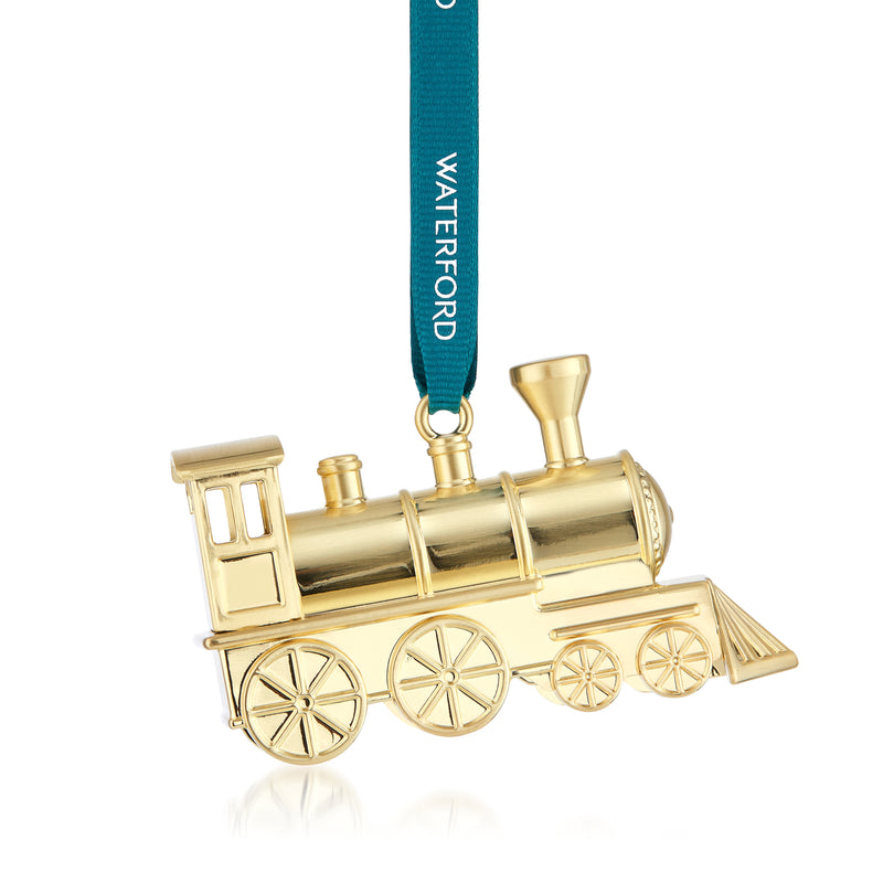 Goldtone steam train ornament with four wheels, smokestack, and teal hanging ribbon