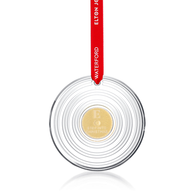 Crystal vinyl record ornament with spiral grooves and gold center, hanging on red ribbon