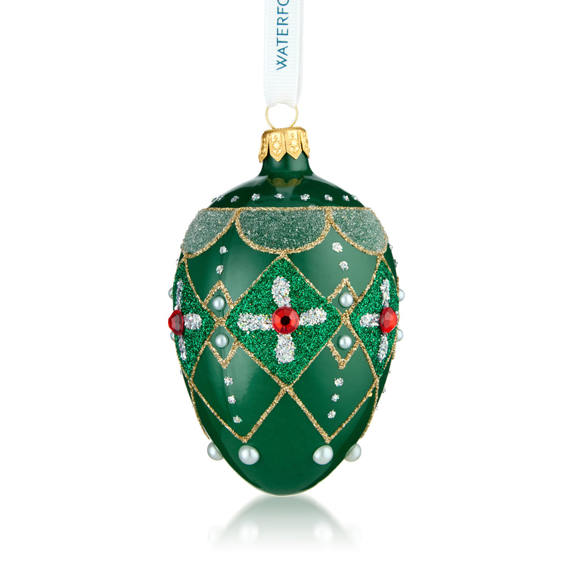 Green oval glass bauble with red accents, gold cap, faceted cutwork, pearl details