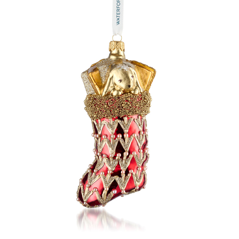 Glass stocking ornament with gold top and red beaded-style trim, hanging ribbon loop