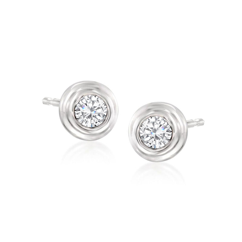 Diamond stud earrings in 14kt white gold with round brilliant center stones