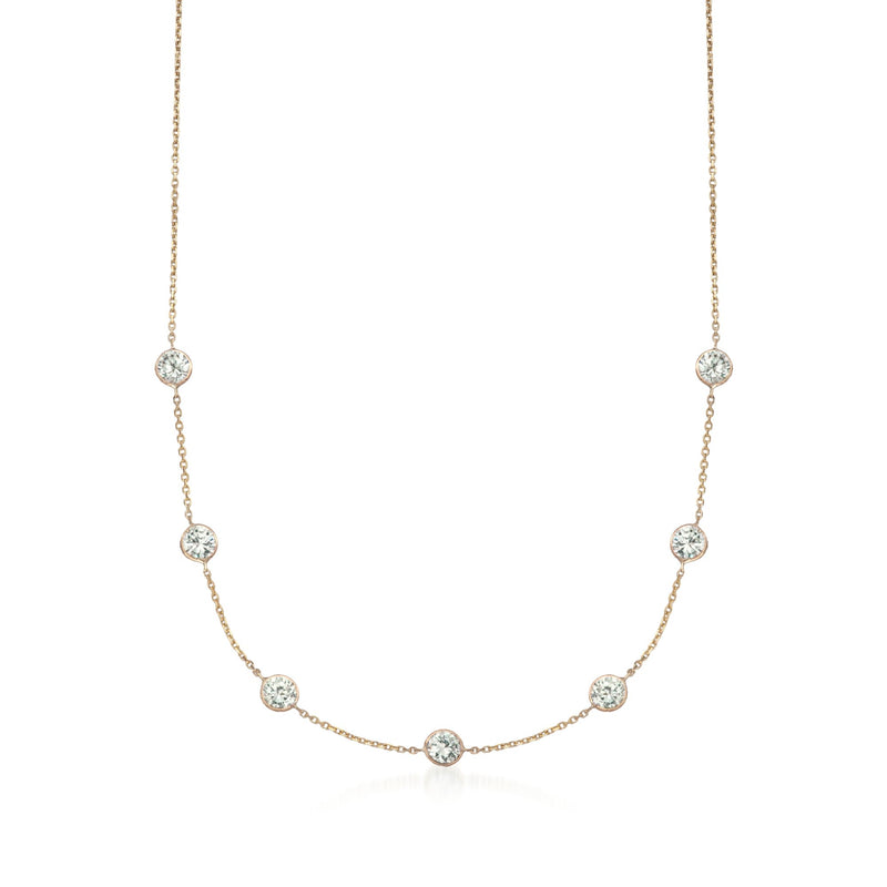 14kt yellow gold CZ station necklace with round clear stones, graduated along chain