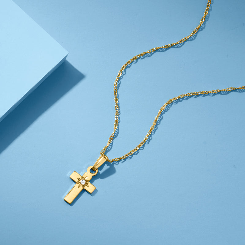 14kt yellow gold cross pendant necklace with single diamond, side view