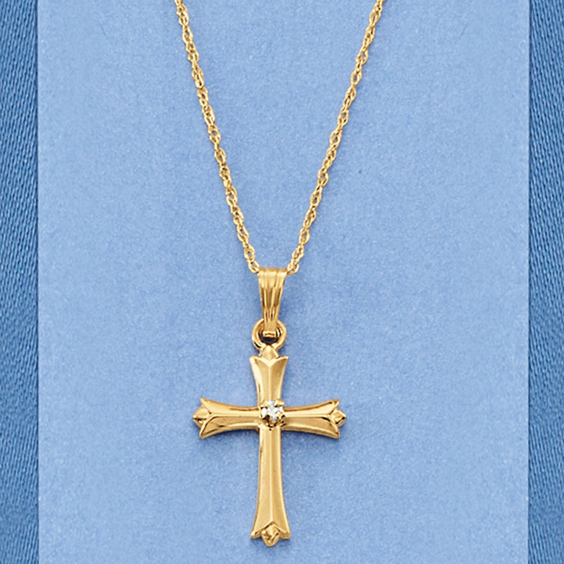 Yellow gold cross pendant necklace with single diamond detail and chain
