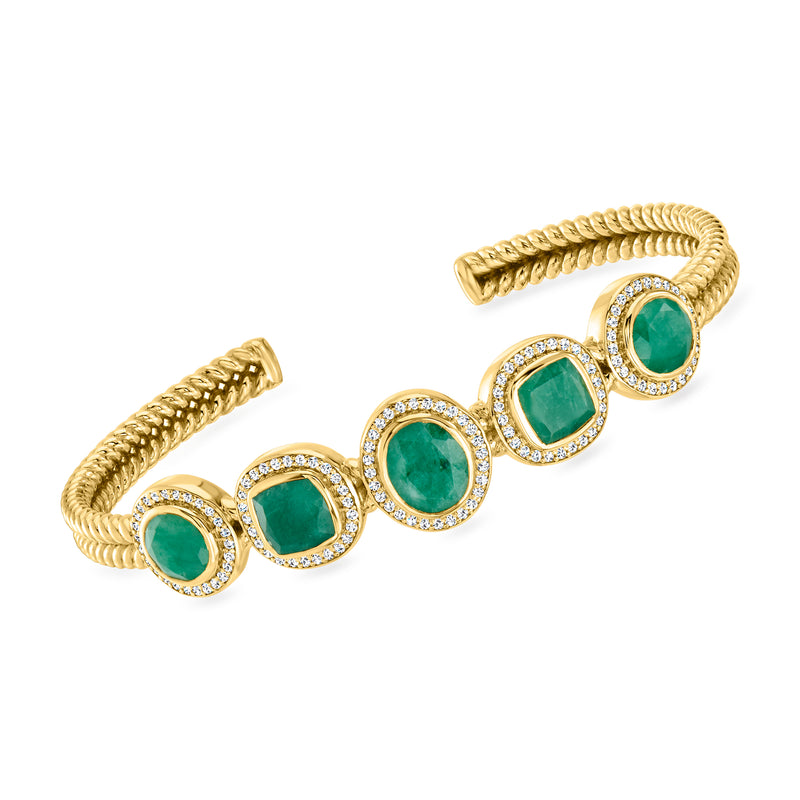 Gold cuff bracelet with round green emerald-style stones and white topaz halo settings