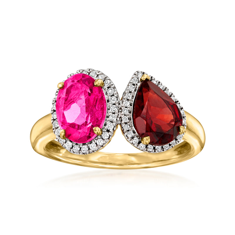 Gold oval toi et moi ring with bright pink and dark red gemstones, surrounded by small clear stones
