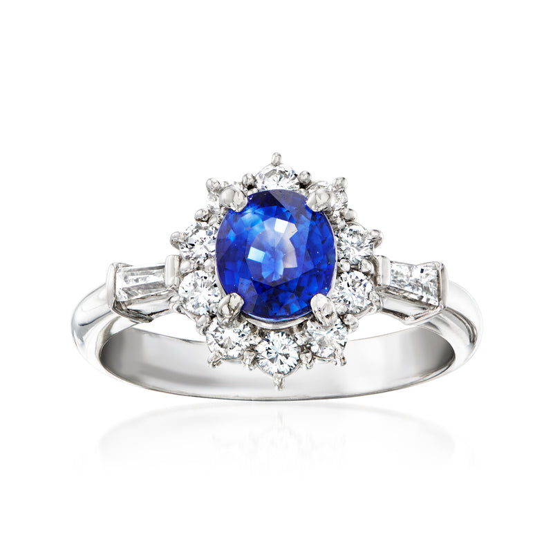 Platinum sapphire and diamond ring with oval blue center stone and diamond halo
