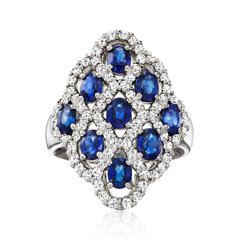 Platinum sapphire and diamond cluster ring with oval blue stones and round diamond halo