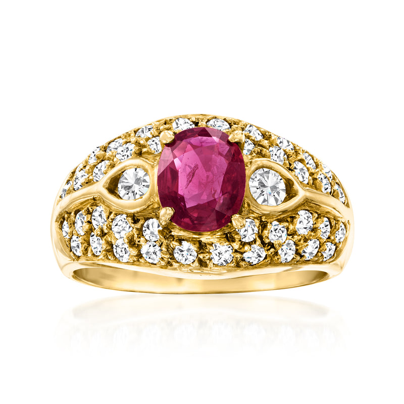 18kt yellow gold vintage ring with oval ruby center and diamond halo accents