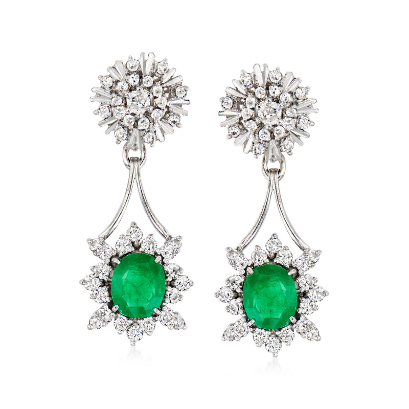 18k white gold drop earrings with emerald-green oval stone and diamond clusters