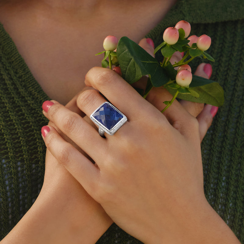 Sterling silver square blue sapphire ring worn on hands