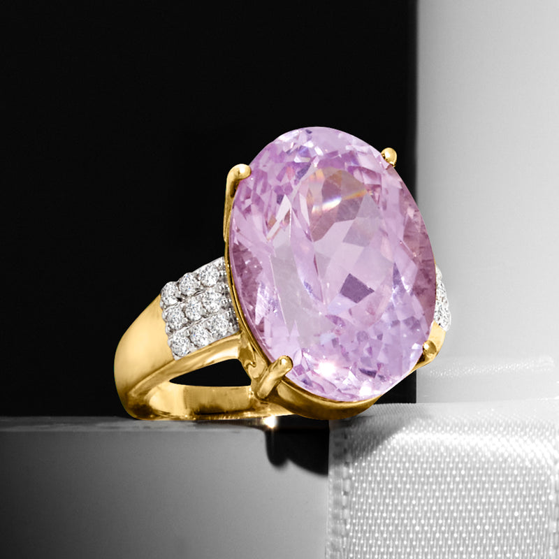 Oval lavender kunzite ring with yellow gold prongs and white diamond baguette accents
