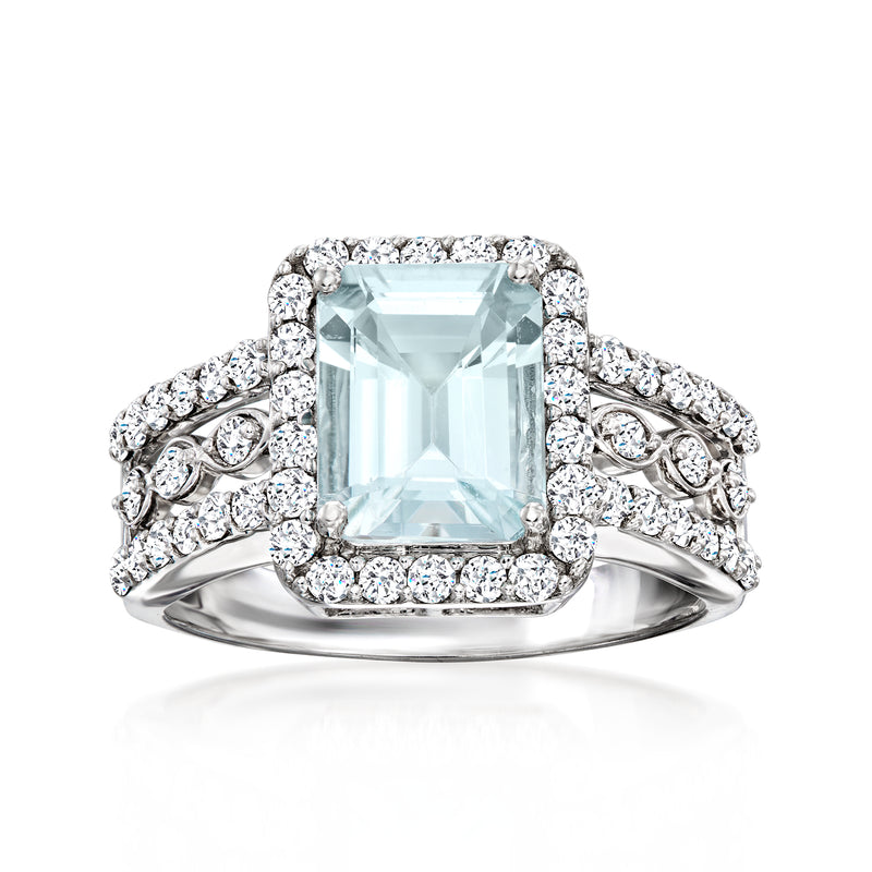 14kt white gold aquamarine and diamond ring with rectangular center stone and side halos