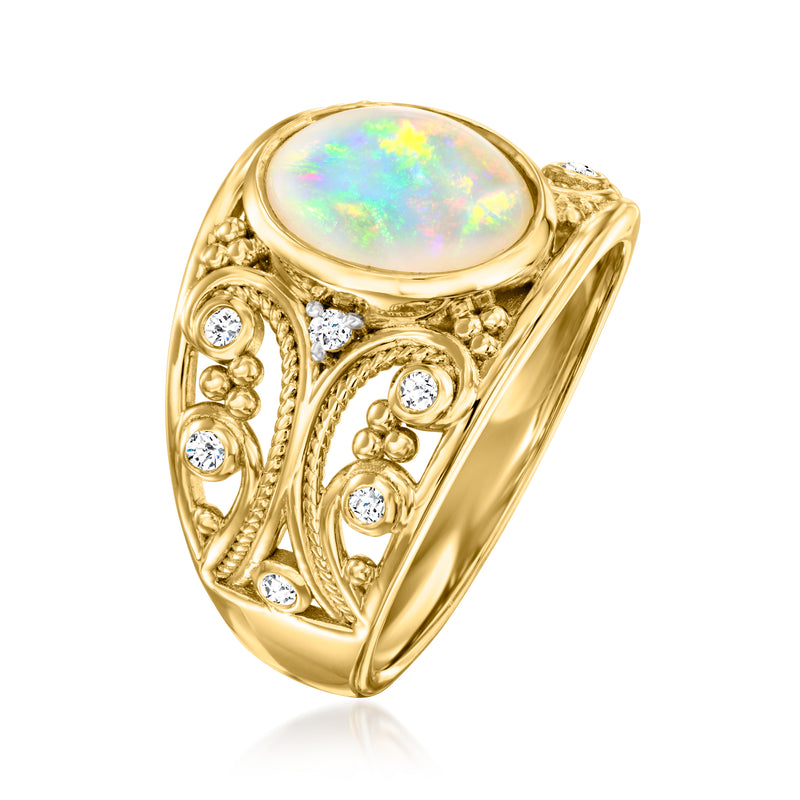 Gold opal cabochon ring with filigree and small round clear stones