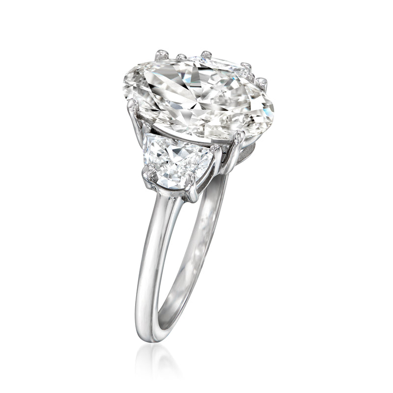 14kt white gold ring with large oval lab-grown diamond and side half-moon stones