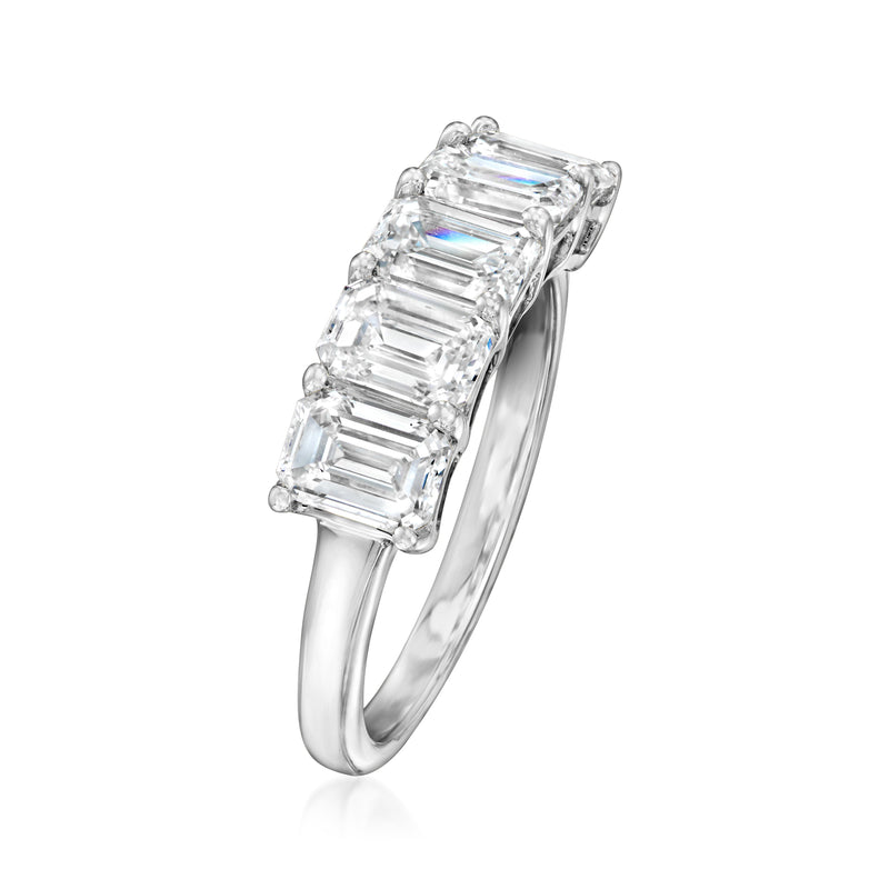 Side view five-stone emerald-cut diamond ring in 14kt white gold with raised stone settings.