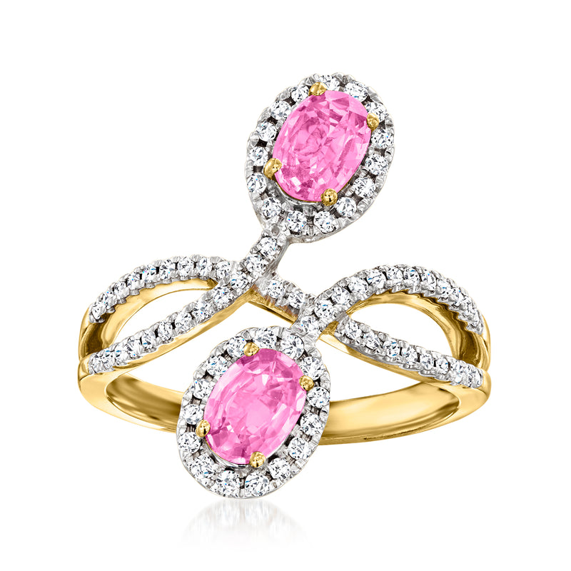 14kt yellow gold bypass ring with two oval pink sapphires and diamond halos