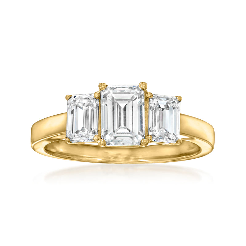 Three-stone emerald-cut diamond ring in 14kt yellow gold, center and side stones