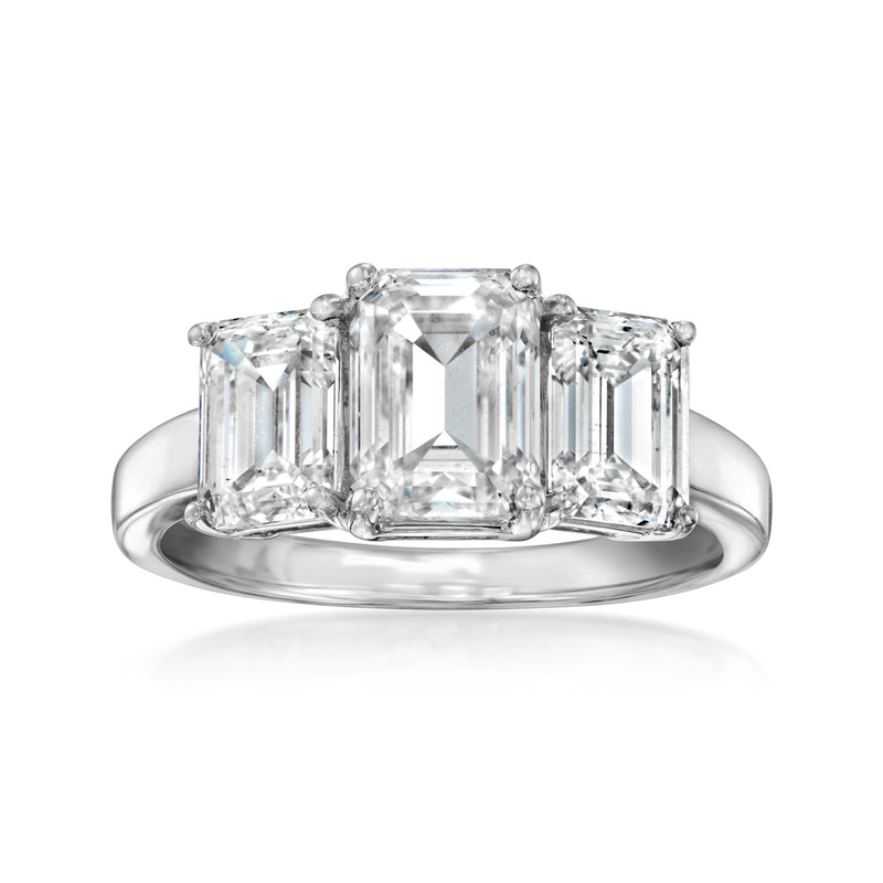 Three-stone emerald-cut diamond ring in 14kt white gold, center and side emerald cuts