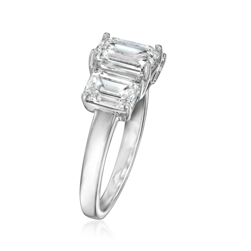 Three-stone emerald-cut diamond ring in 14kt white gold, angled side view