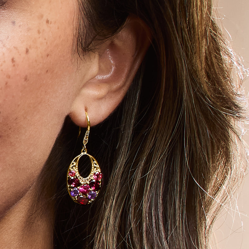 Gold over sterling oval multi-gem drop earring close-up, dangling on earwire
