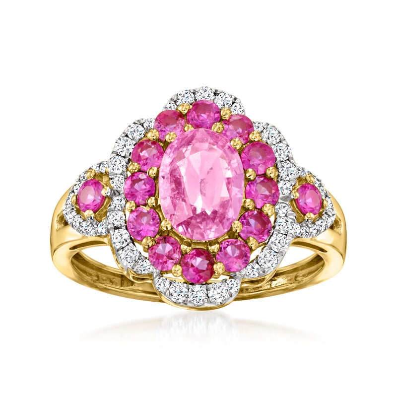 14kt yellow gold ring with oval pink sapphire center, pink halo, diamond accents