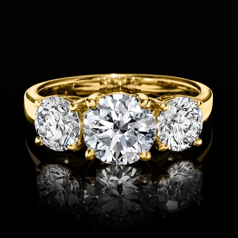 14kt yellow gold three-stone round lab-grown diamond ring, top view with prongs