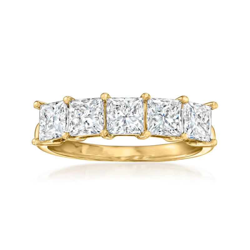 Yellow gold princess-cut diamond ring with five rectangular stones and prongs.