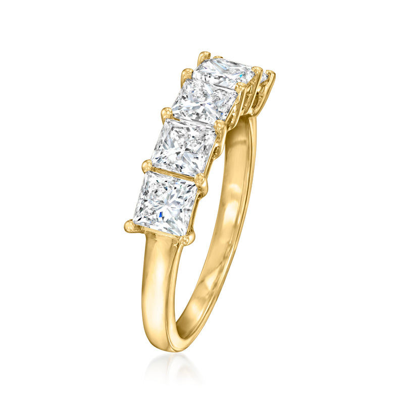 Yellow gold princess-cut diamond ring in side view, three rectangular stones visible.