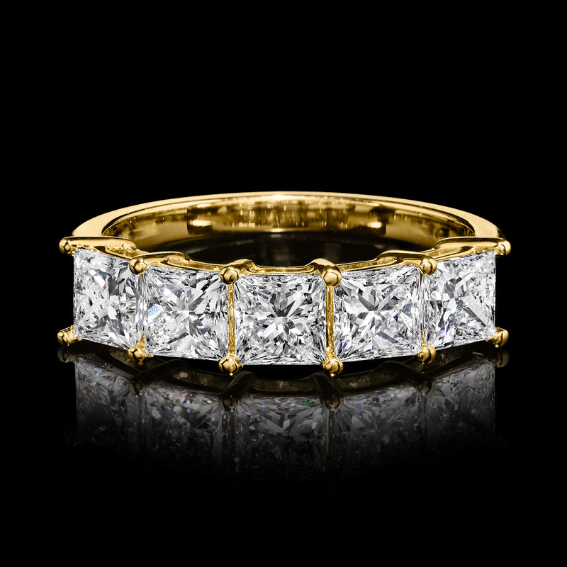 Yellow gold princess-cut diamond ring with five rectangular diamonds, front-on view.