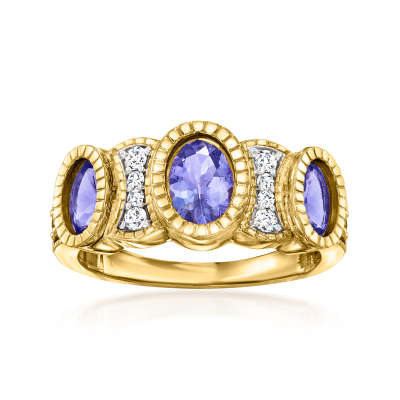 14kt yellow gold tanzanite ring with oval center, two purple side stones, diamond accents