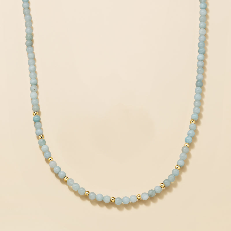 Aquamarine bead necklace, light blue beads with yellow gold spacer beads.