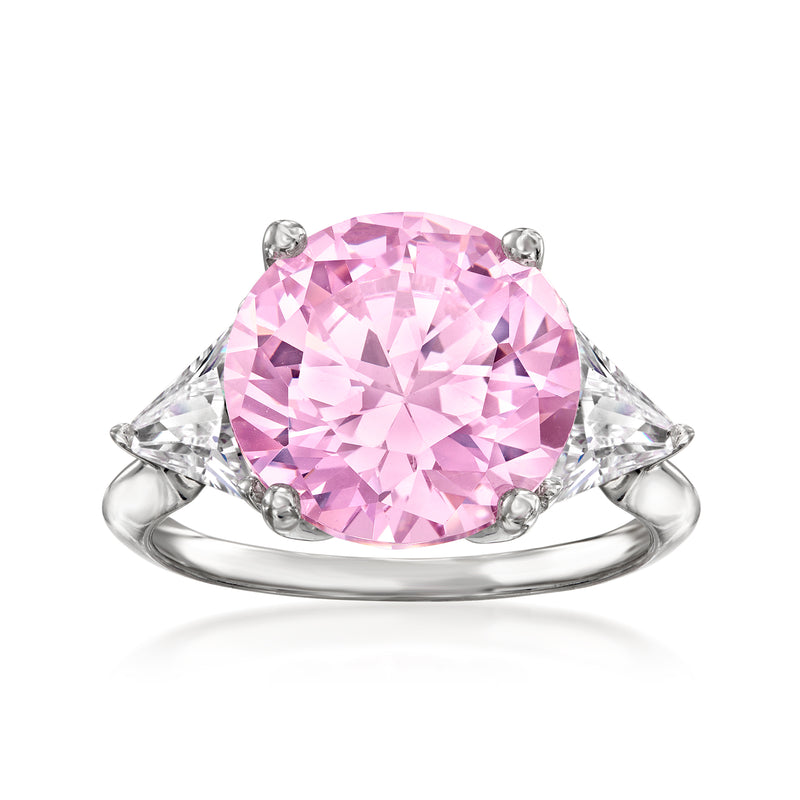 Sterling silver ring with oval pink simulated sapphire center and CZ side stones