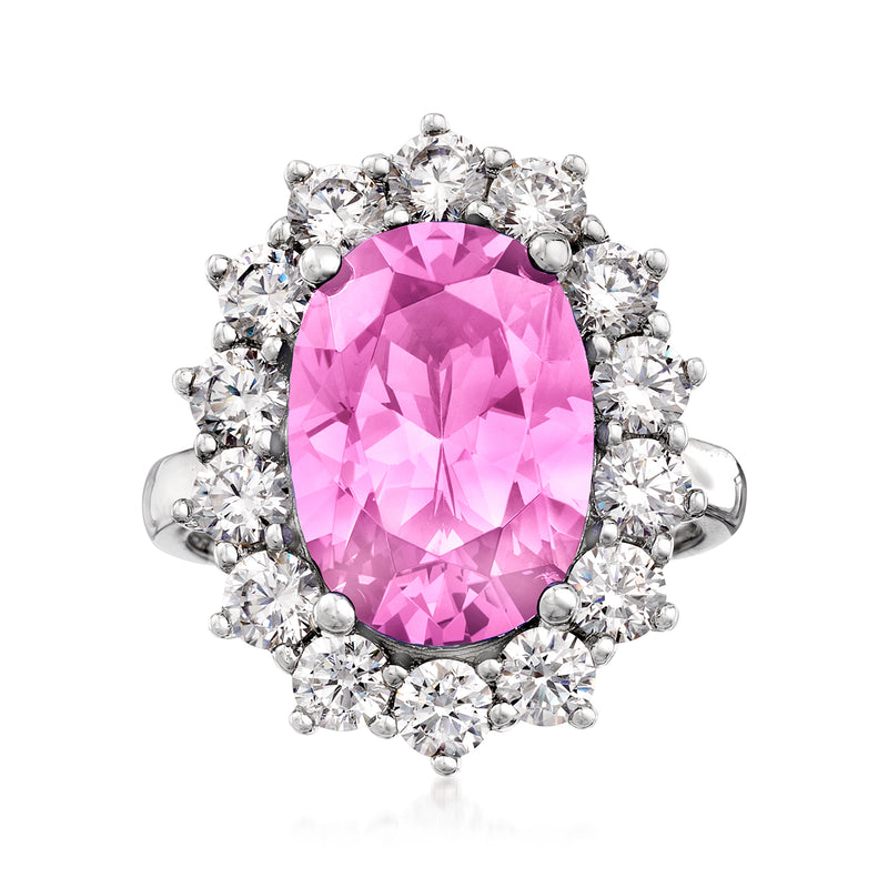 Sterling silver ring with pink oval center and clear round stone halo
